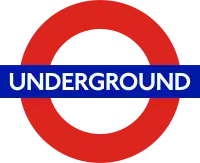 The word "UNDERGROUND" in white letters superimposed on a blue rectangle superimposed on the red circumference of a circle on a clear background