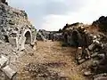 Ruins of an arched structure at the base of the monastic complex