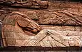 Detail of a horse on the left side of the front relief