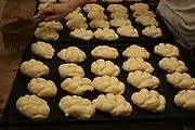 7. Sprinkling the rolls with water