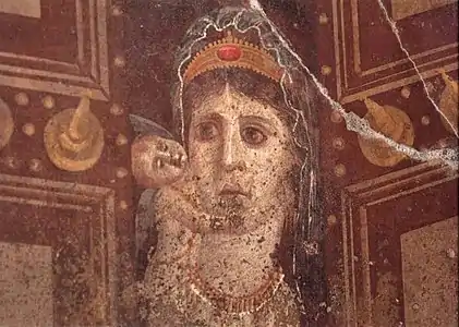 This mid-1st&nbsp;century&nbsp;AD Roman wall painting in Pompeii, Italy, showing Venus holding a cupid is most likely a depiction of Cleopatra VII of Ptolemaic Egypt as Venus Genetrix, with her son Caesarion as the cupid.