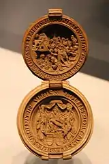 Prayer nut (WB.238) with upper Magi and a lower Pieta with Saint James the Greater, Saint Ursula and inscriptions, c. 1510-1525, British museum