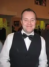 John Higgins looking at the camera