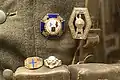 Close-up of the "Fronterkjempermerket", "Pohjoisrintama Die Nordfront 1941-1943" (Finland/Third Reich Finnisch-deutsches Nordfrontkreuz), SS Nordland ring and skull ring; Lofoten War Museum, Norway.