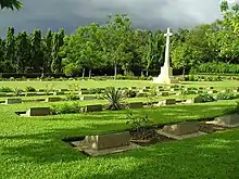 Image 13Chittagong War Cemetery is a Commonwealth War Graves Commission cemetery located at Dampara 22 kilometers north of the airport and 8 kilometers from the port. The burial area is surrounded by a large plantation. A tarmac lane leads from the entrance gate to the burial area which is entered through a metal gate flanked by two small brick chapels.Photo Credit: Hossain Toufique Iftekher