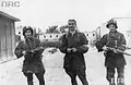 Three Polish resistance fighters pictured after liberating the "Gęsiówka” concentration camp - from left to right: an unknown insurgent, Stanisław Kozicki (code name "Howerla") and Wacław Cyniak (code name "Orlicz")