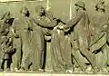 Relief from the Soviet military cemetery in Warsaw showing workers greeting victorious soldiers.