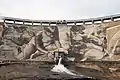 Central Panel of mural artwork with water outlet flowing.