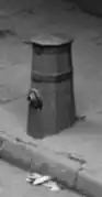 Old style wooden "fire plug" still in use c. 1900
