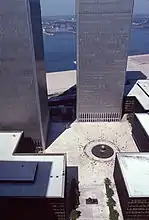 Austin J. Tobin plaza with The Sphere sculpture in the center of plaza and South and North towers and WTC complex surrounding it