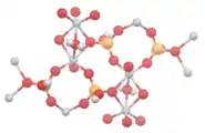 In .mw-parser-output .template-chem2-su{display:inline-block;font-size:80%;line-height:1;vertical-align:-0.35em}.mw-parser-output .template-chem2-su>span{display:block;text-align:left}.mw-parser-output sub.template-chem2-sub{font-size:80%;vertical-align:-0.35em}.mw-parser-output sup.template-chem2-sup{font-size:80%;vertical-align:0.65em}VO(HPO4)·0.5H2O, pairs of vanadium(IV) centers are bridged by water ligands.