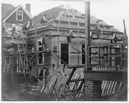 A simple putlog type scaffolding and roof brackets.
