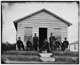Officers of Companies A and B, 3d Massachusetts Heavy Artillery, before quarters at Fort Totten