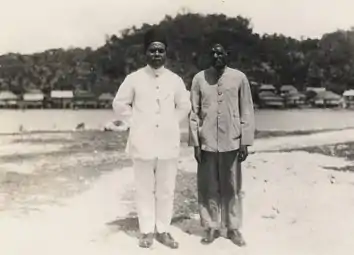 Two Papuan raja wearing kopiah in Kokas, Fakfak (between 1933-1936).