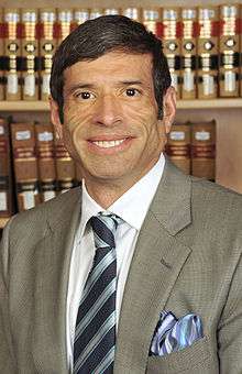 Man in suit and tie smiling